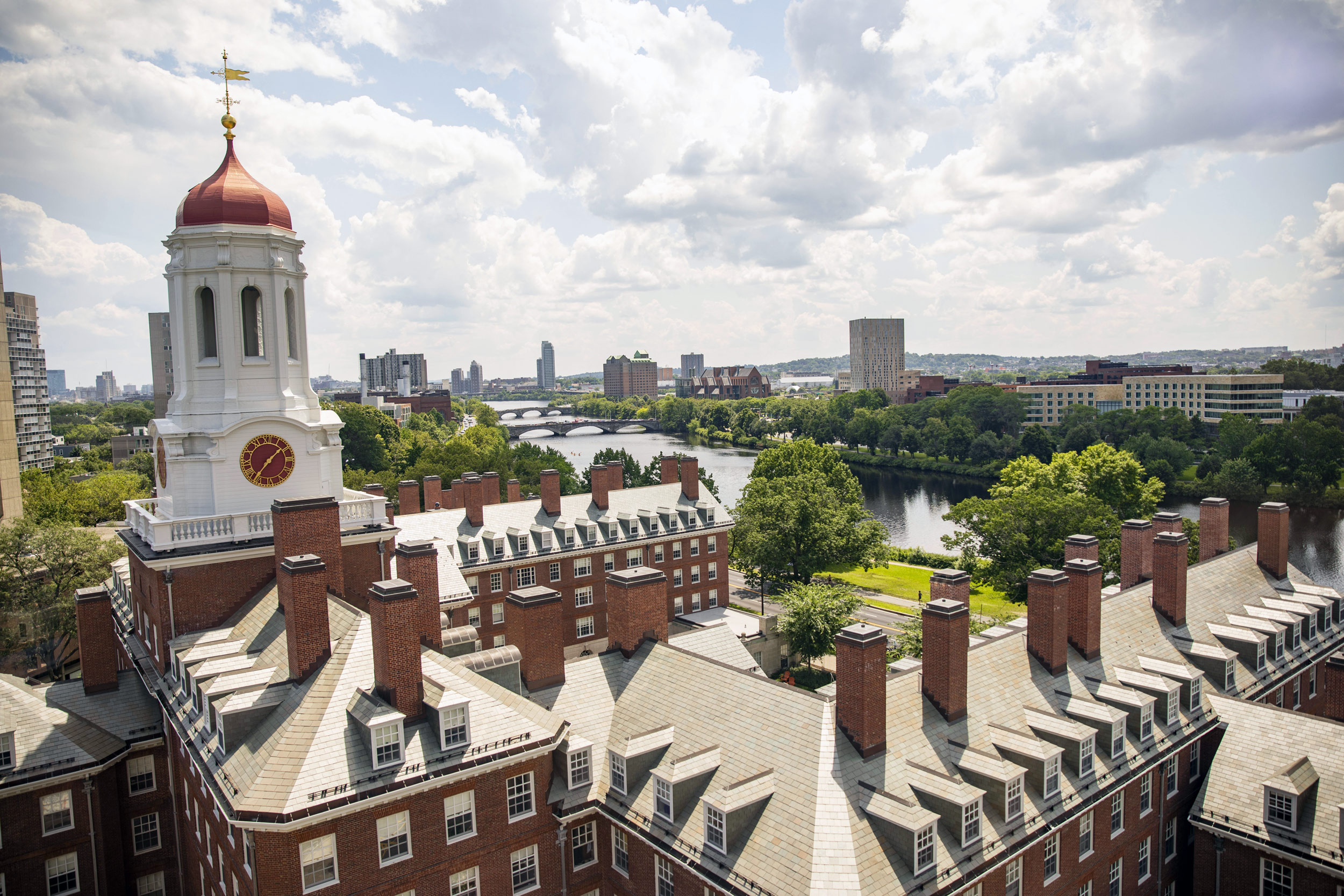 Dunster House sits attractively along the Charles River and the Weeks Footbridge.