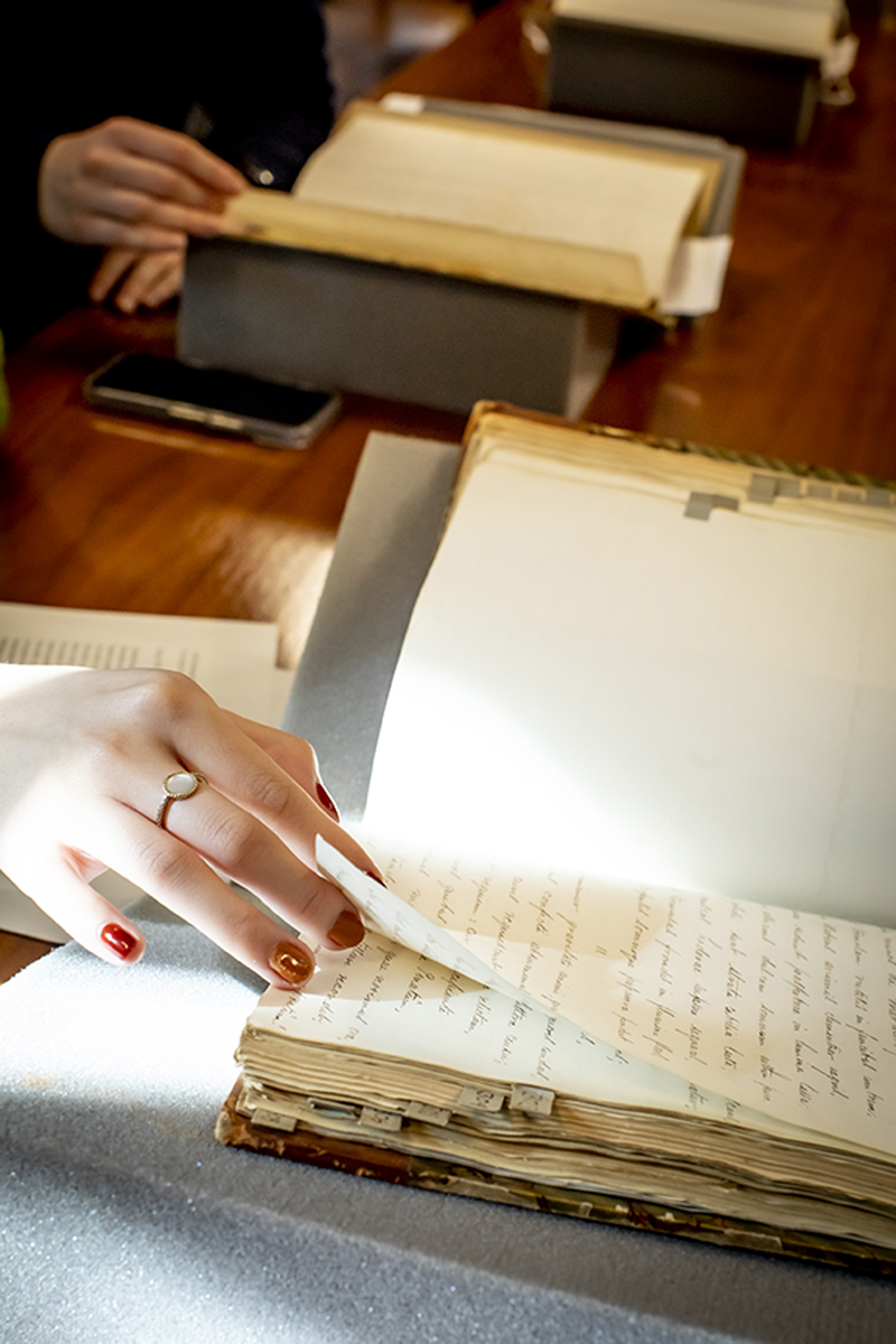 Students page through Latin texts at Houghton Library.