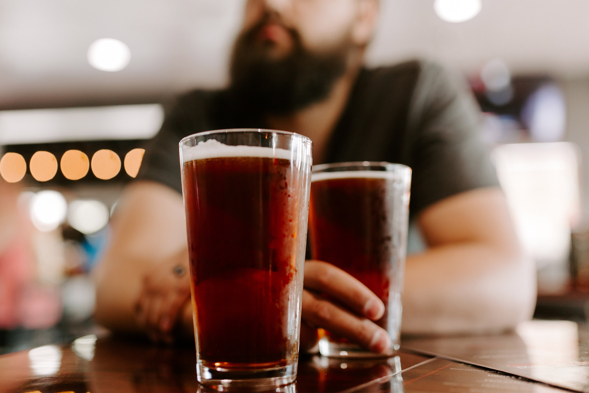 Man with two beers.