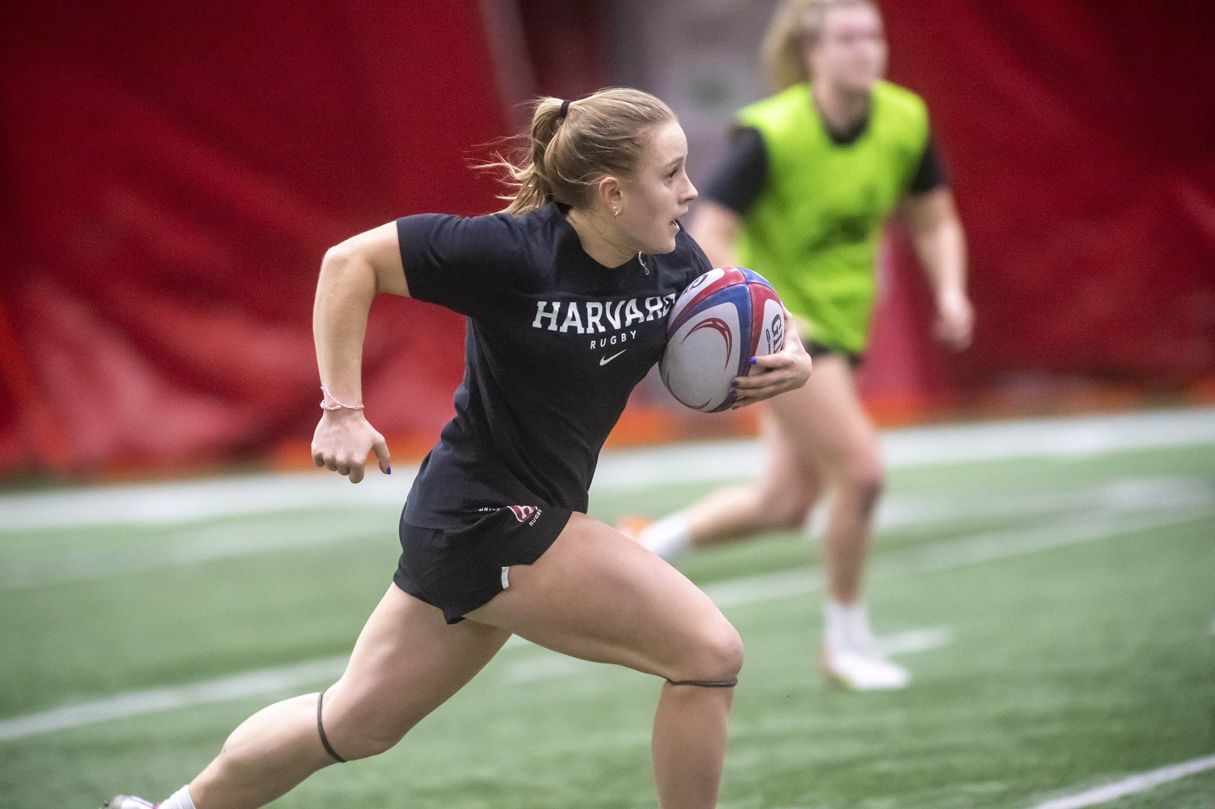 Cass Bargell playing rugby.