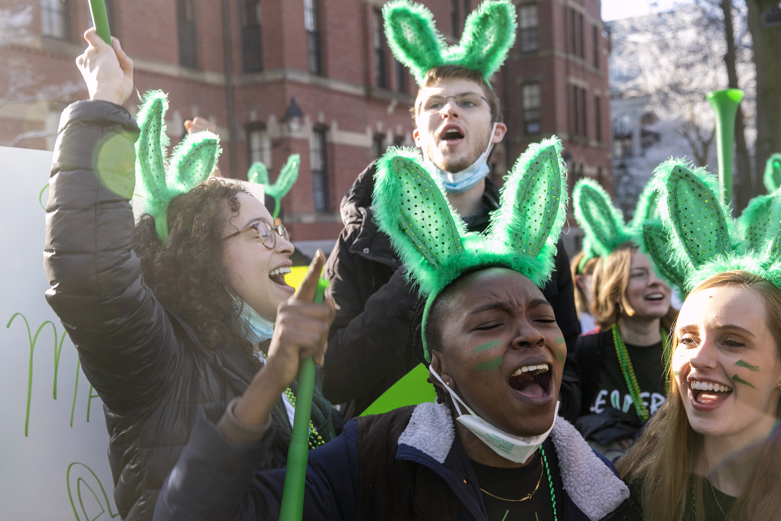 Tuzo Mulunda ’23 wears bunny ears to celebrate Leverett House.