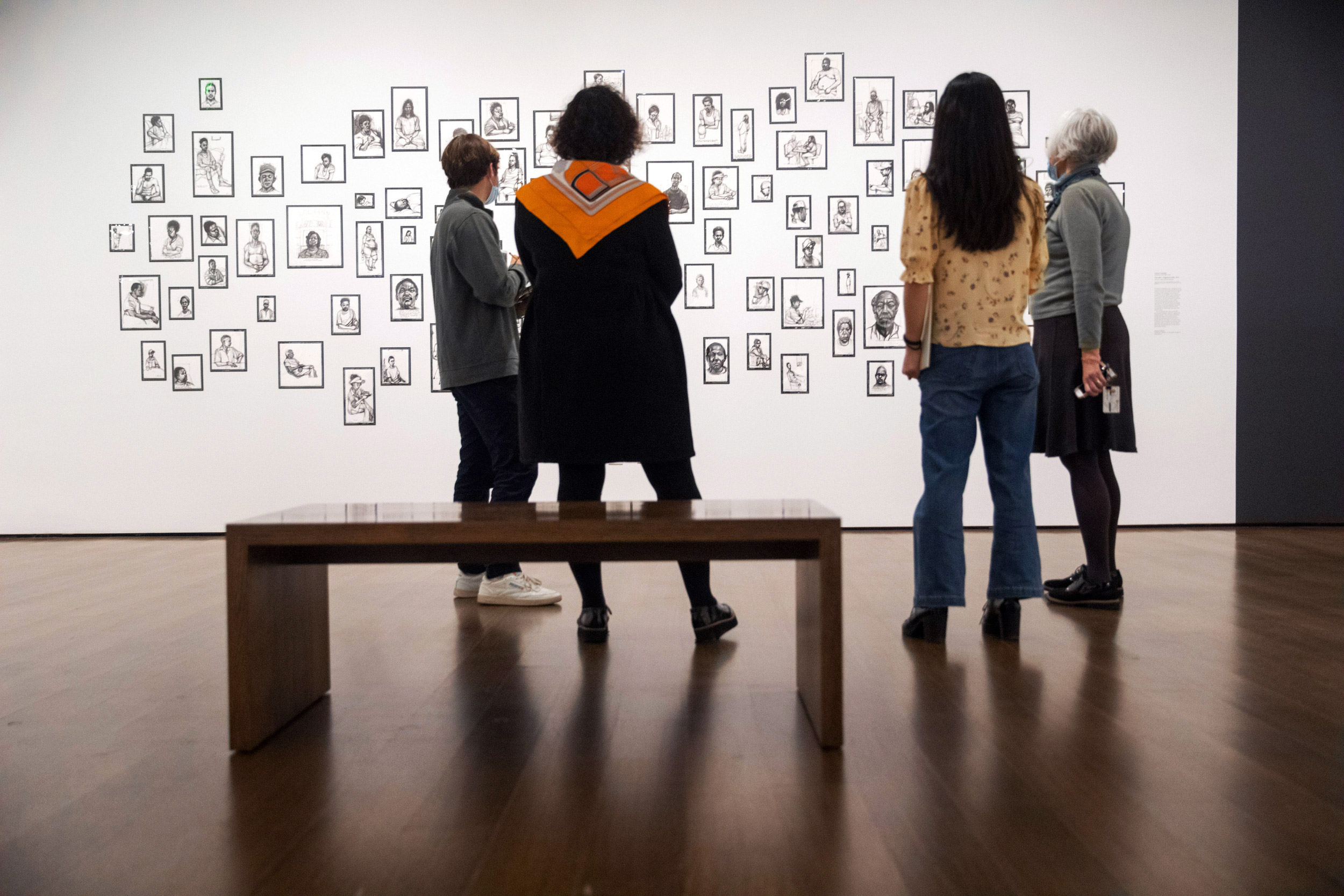 Co-curators of the exhibition, Elizabeth Rudy (2nd on the left) and Sarah Kianovsky (right), the