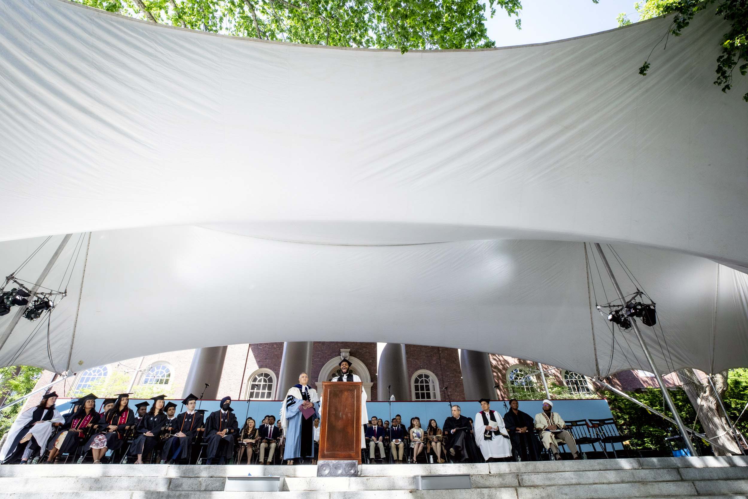 Rev. Calvon Jones sings his blessing under the tent.