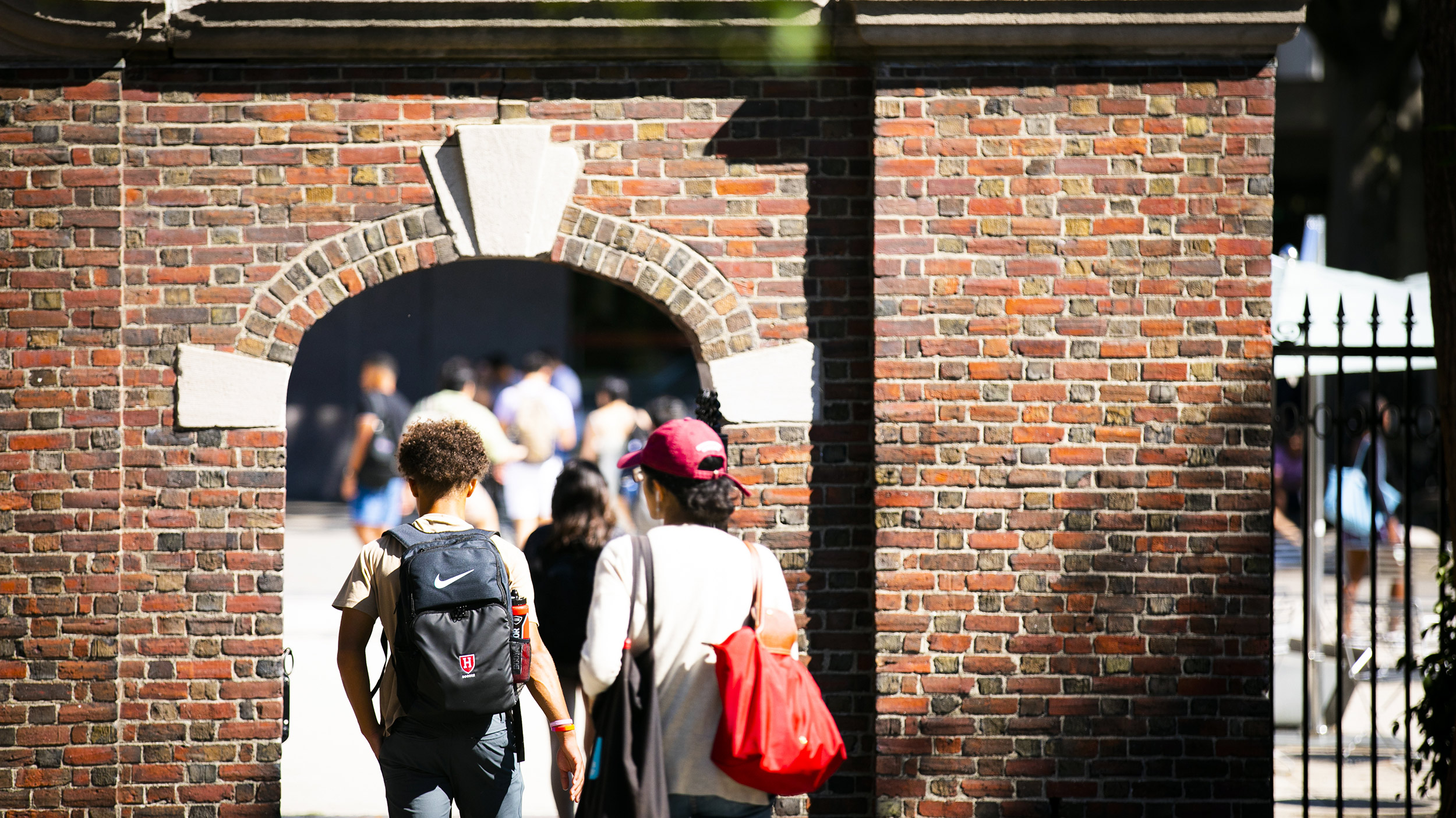 Students enter campus gate.