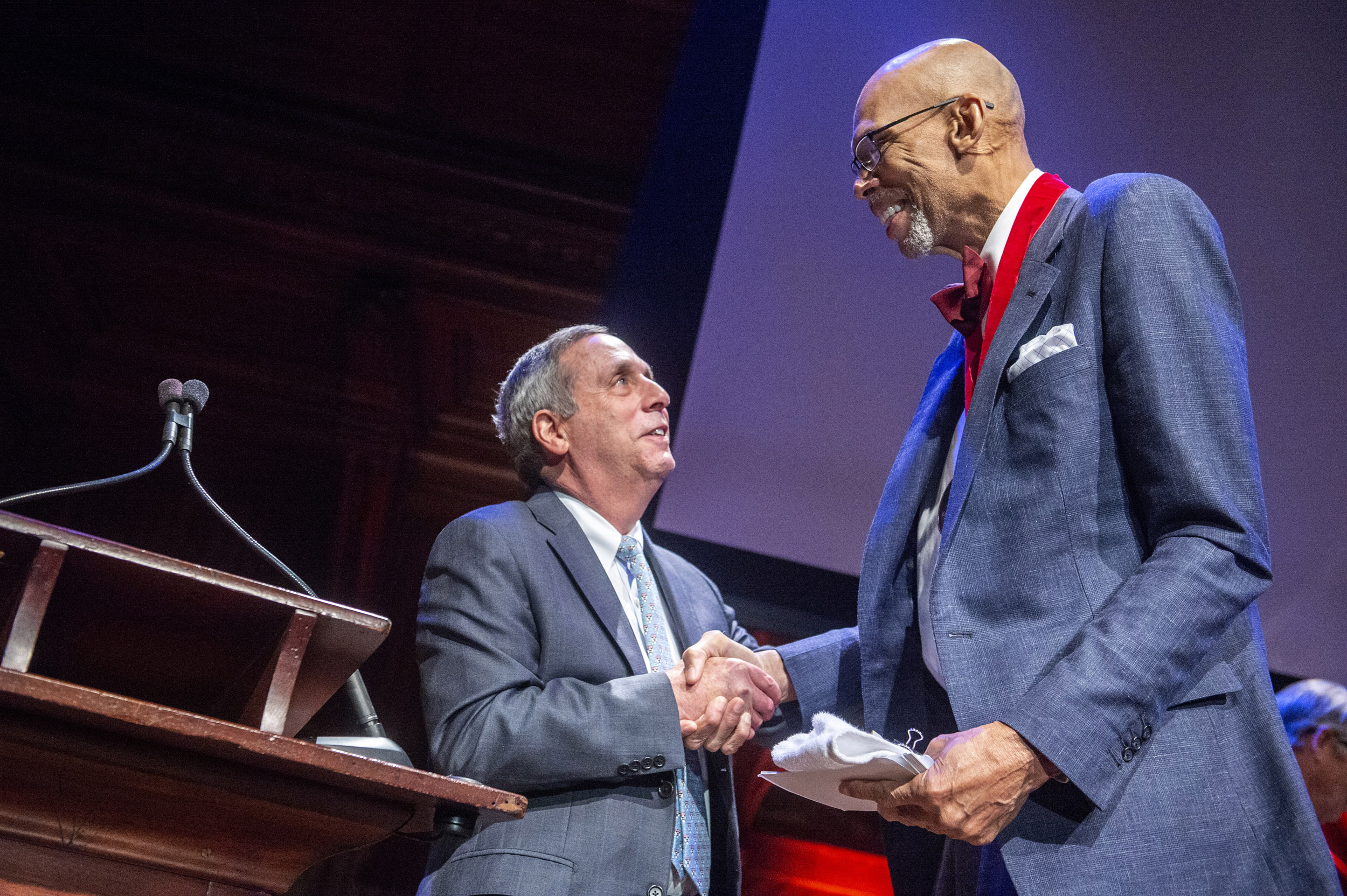 President Larry Bacow congratulates Kareem Abdul-Jabbar on his medal.