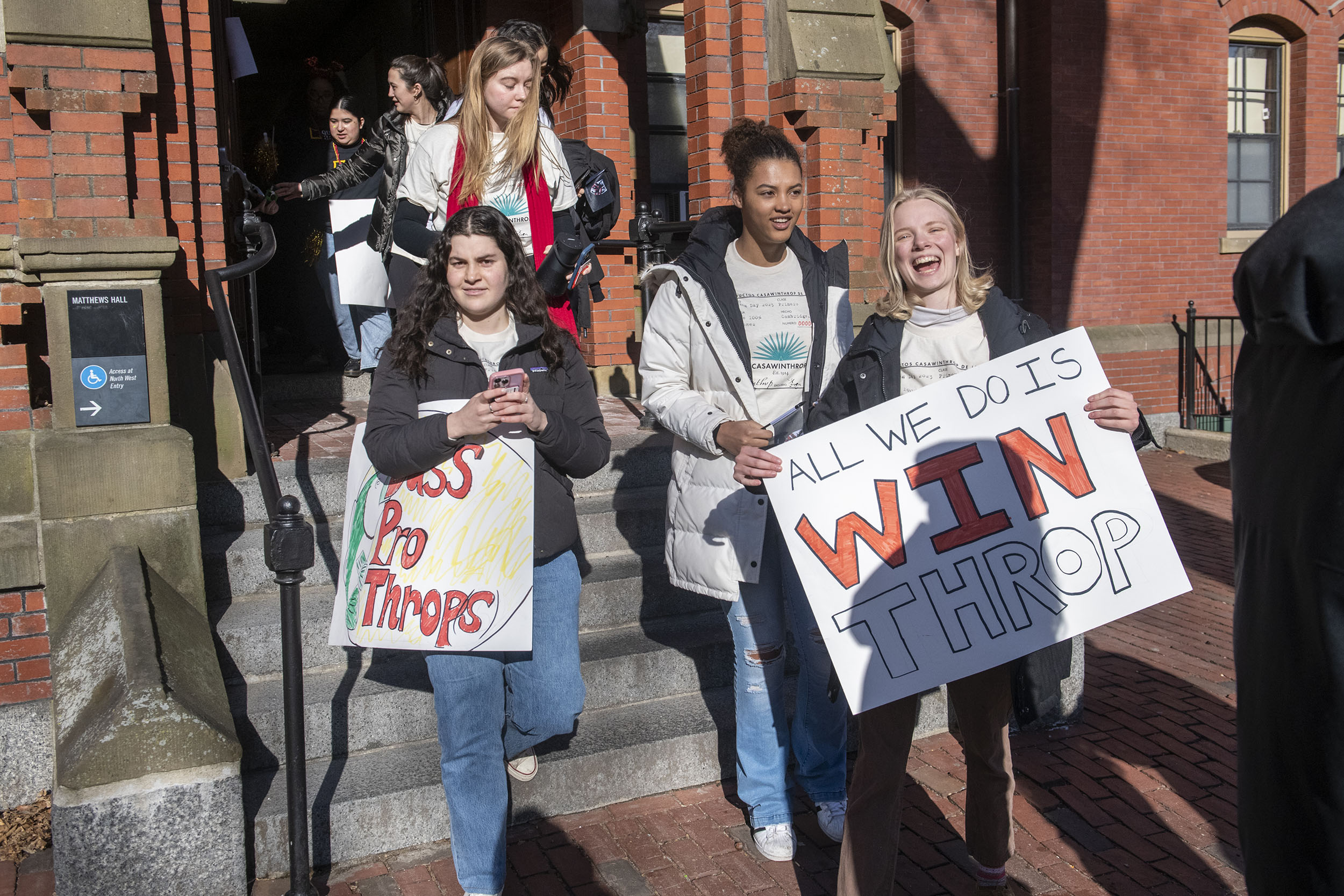 Jubilant Winthrop House members exit Matthews Hall.