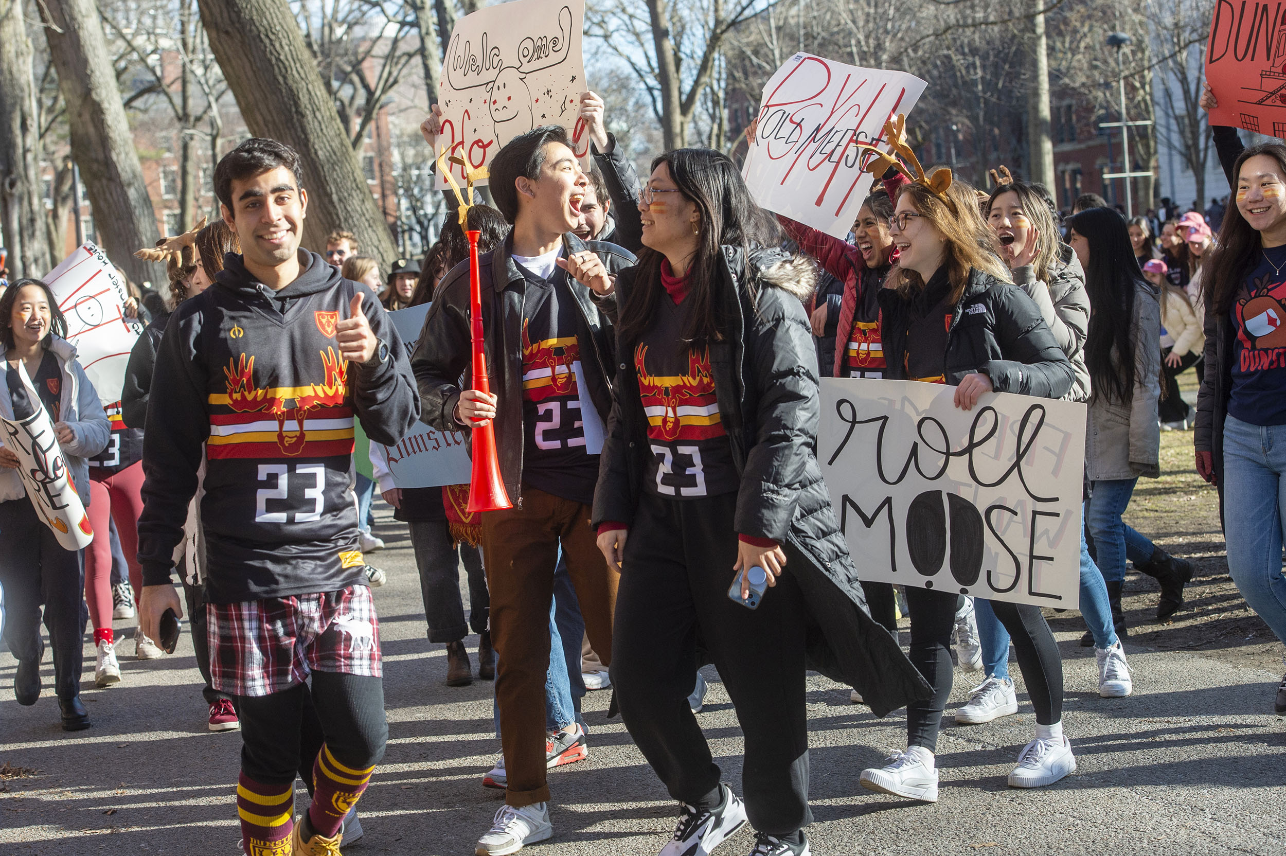 Dunster House members march toward Matthews Hall.