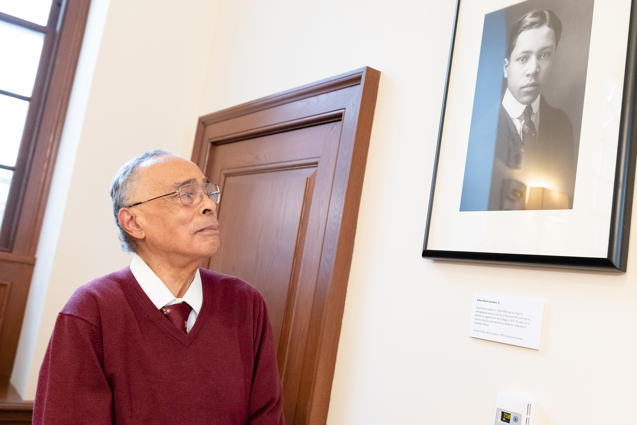 Spencer Jourdain looks up at portrait of father Edwin Bush Jourdain Jr.