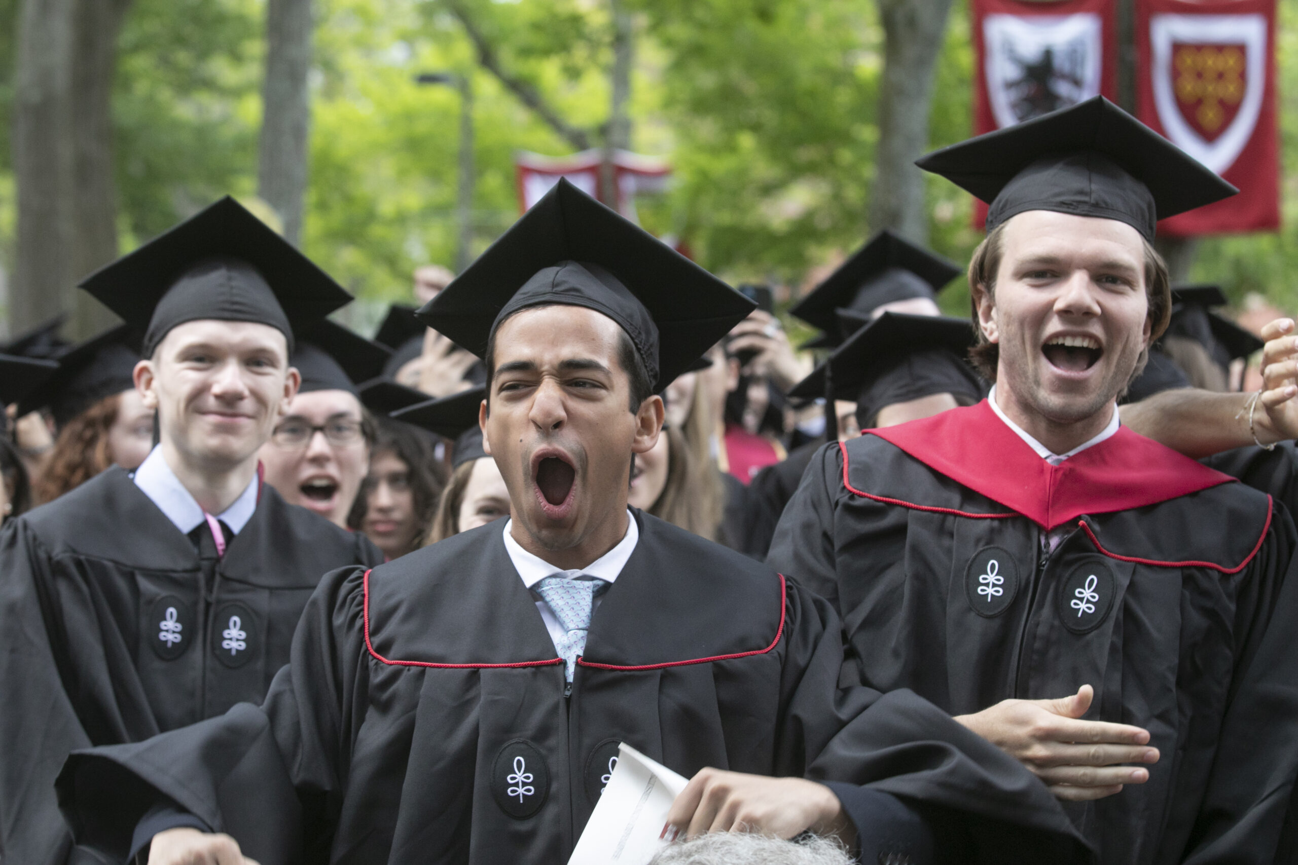 Graduates cheer.