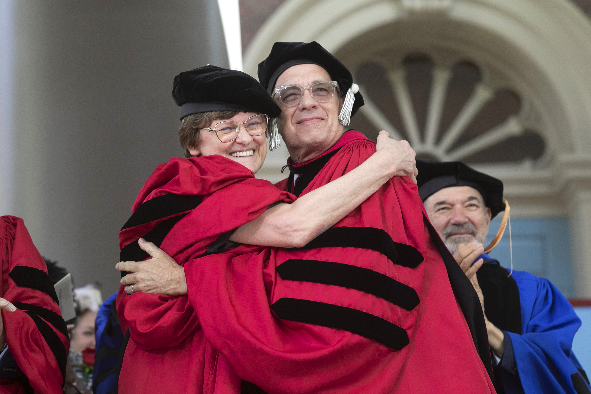 Katalin Karikó and Tom Hanks hug.