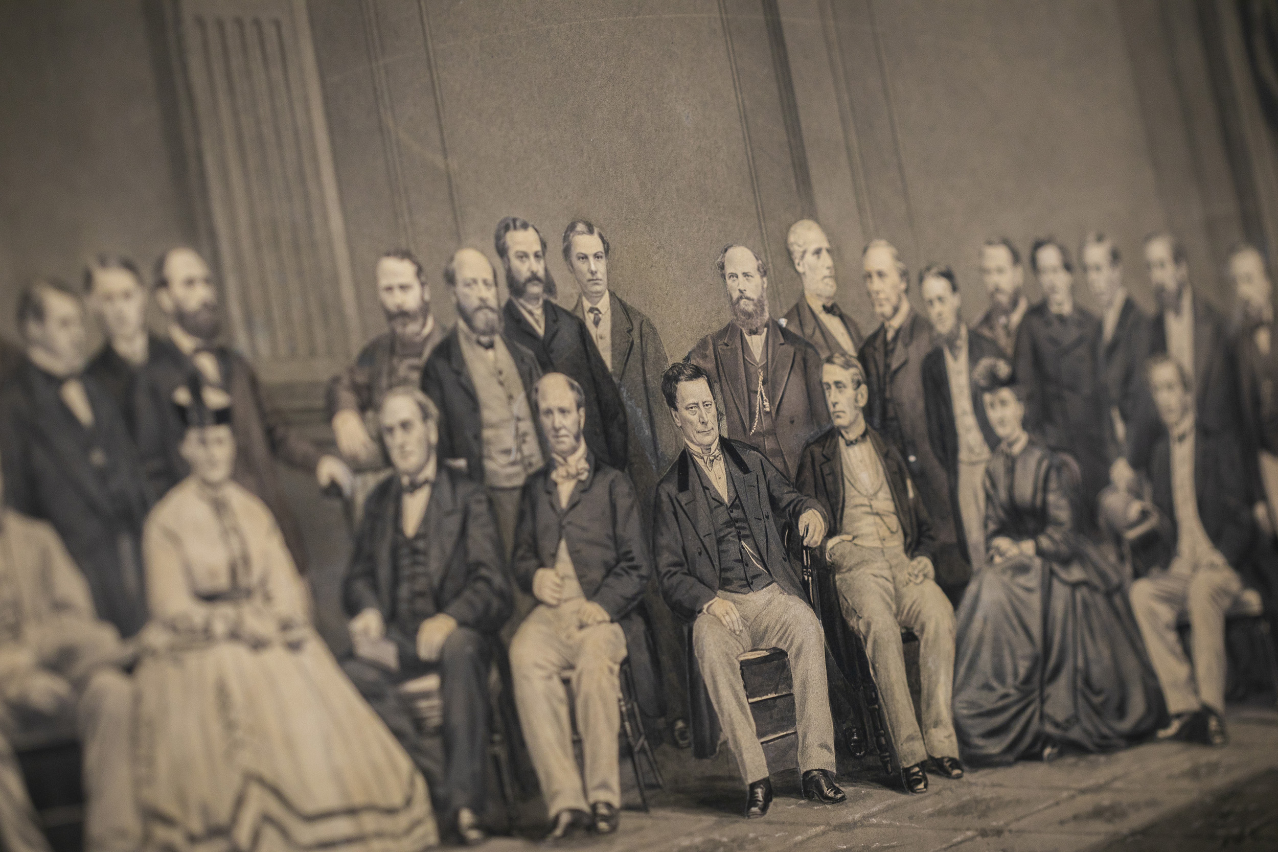 People in a group potrait in 1865 looking in different directions and not at the camera.