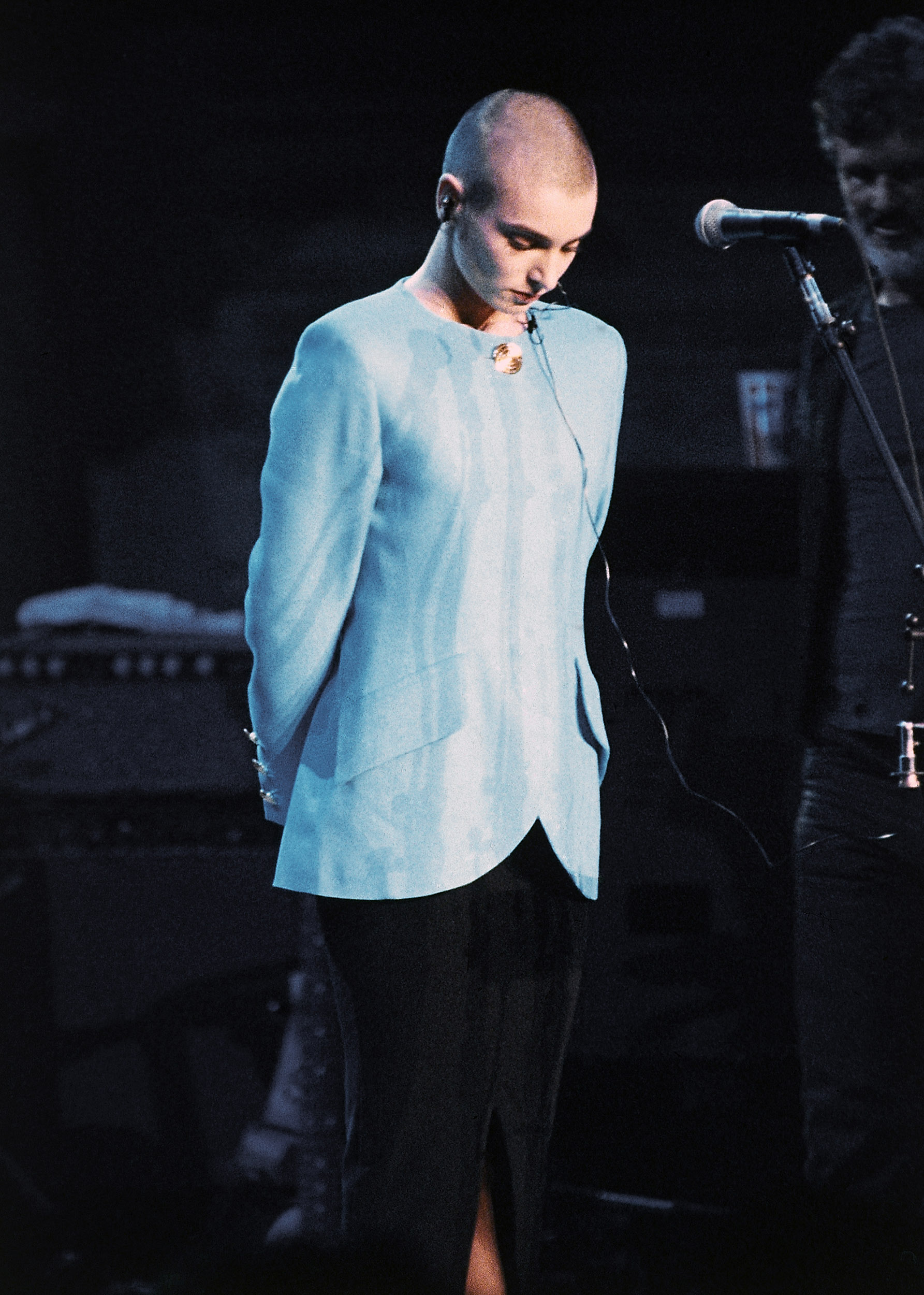 Sinead O’Connor looks down as she is booed onstage.