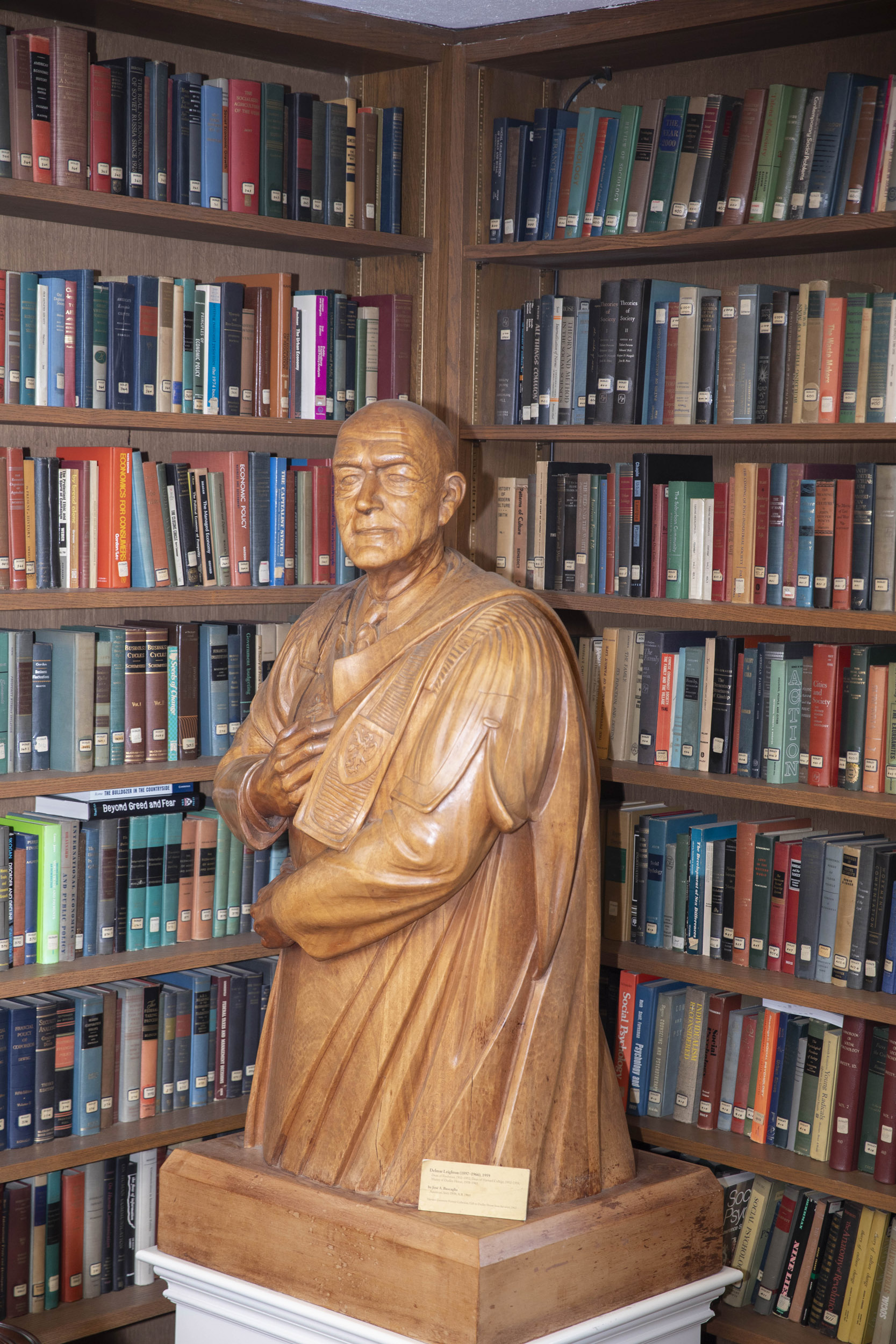 A wooden sculpture of former Dean Delmar Leighton (Class of 1919).