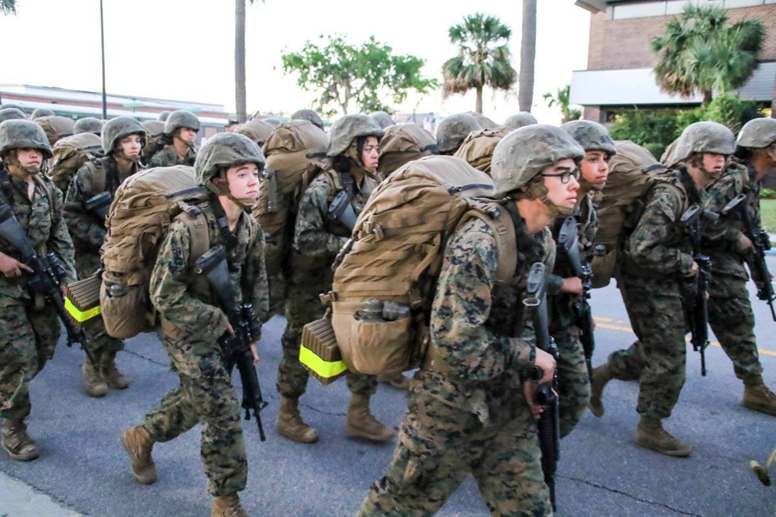 Alyssa Ross marching in uniform.