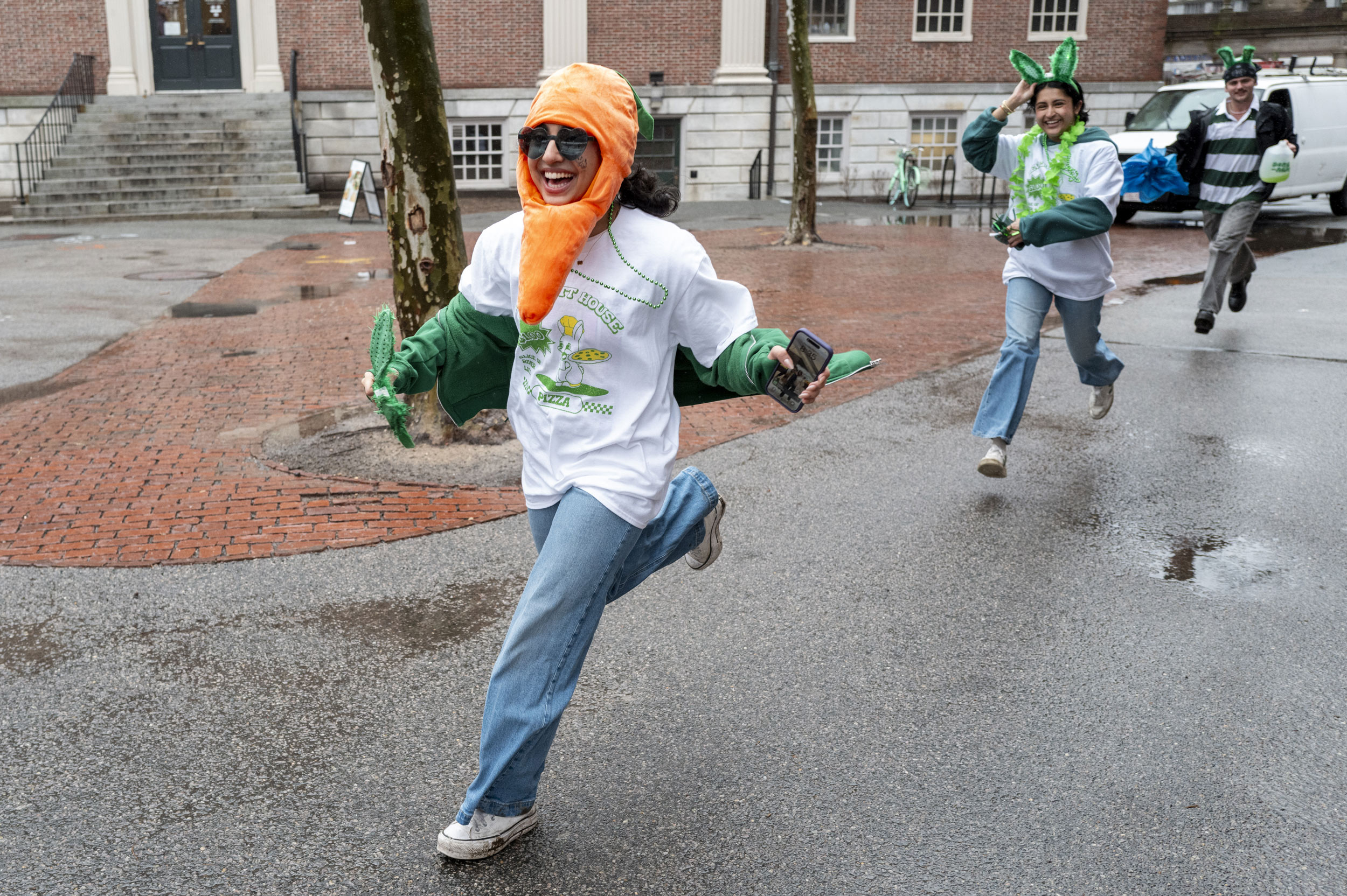 Dressed as a carrot a Leverett House members run toward the Yard.