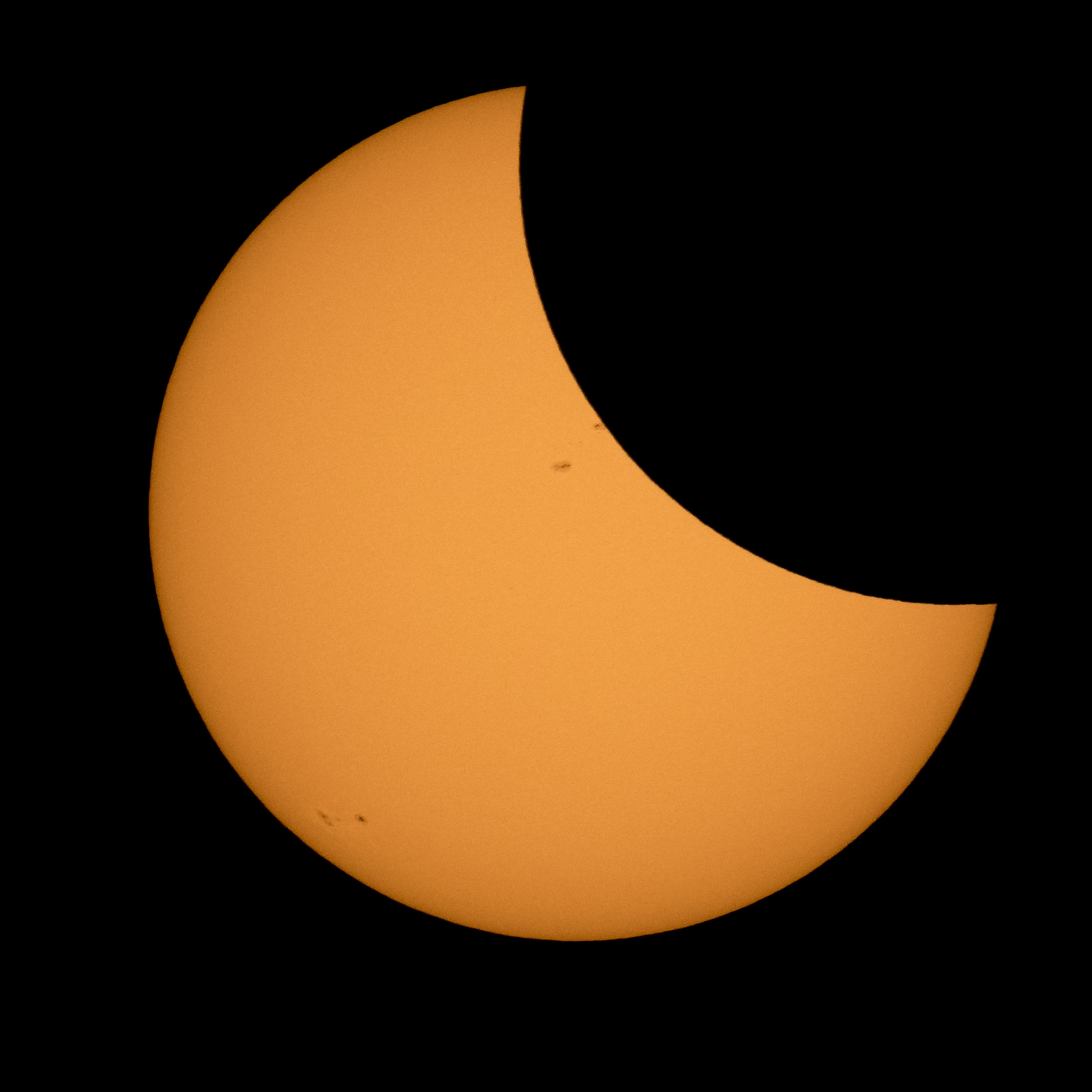 Moon partially eclipsing sun.