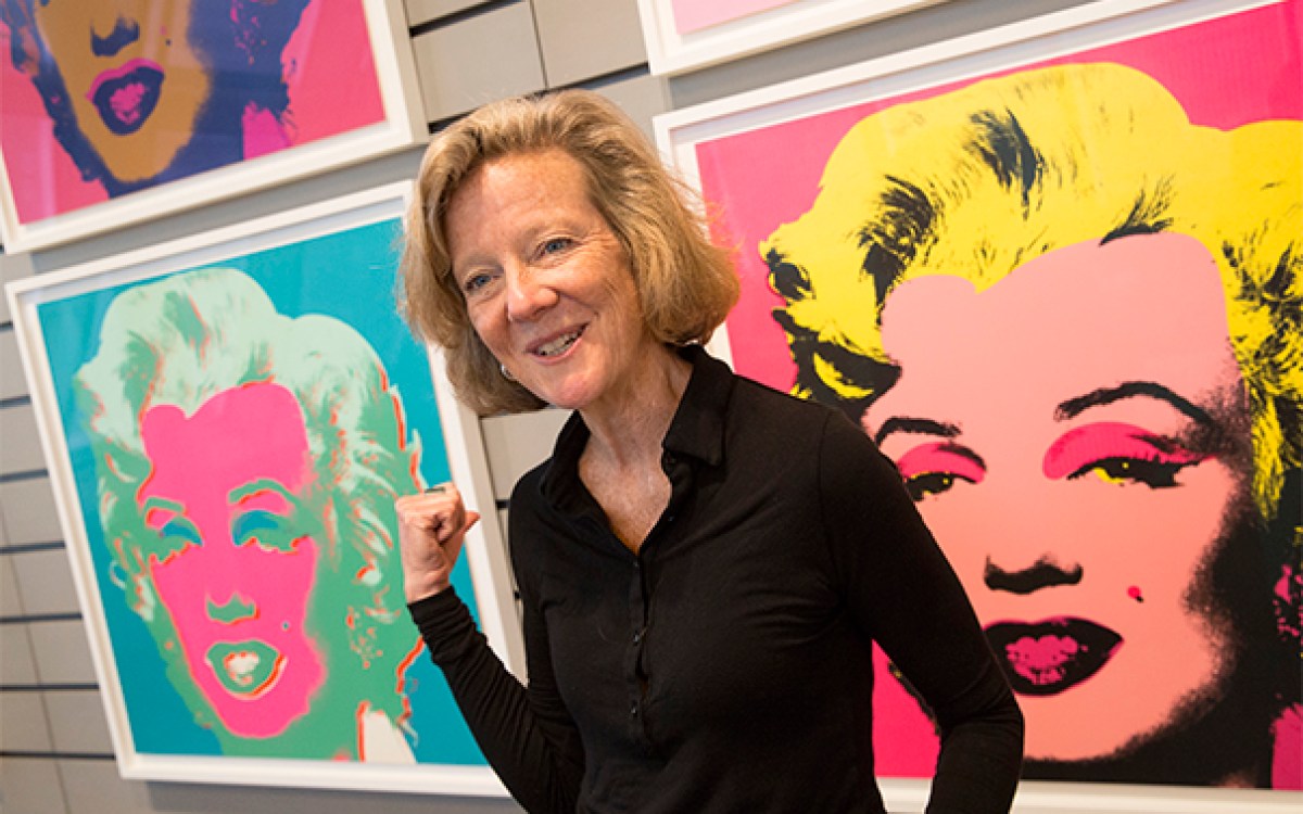 Curator Mary Schneider Enriquez with Andy Warhol silkscreen prints of Marilyn Monroe, at the Harvard Art Museums..Jon Chase/Harvard Staff Photographer.