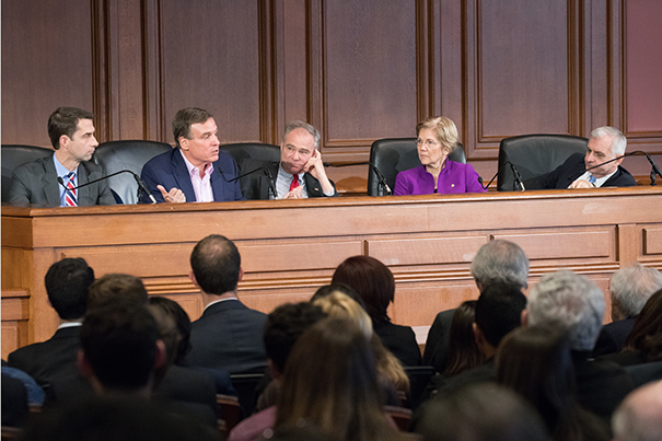 From left, moderator David Gergen, Sens. Tom Cotton, Mark Warner, Tim Kaine, Elizabeth Warren, and Jack Reed.