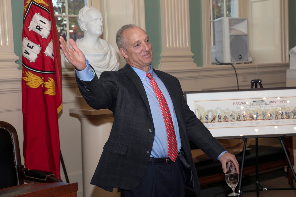 Michael D. Smith waves goodbye at a faculty sendoff.