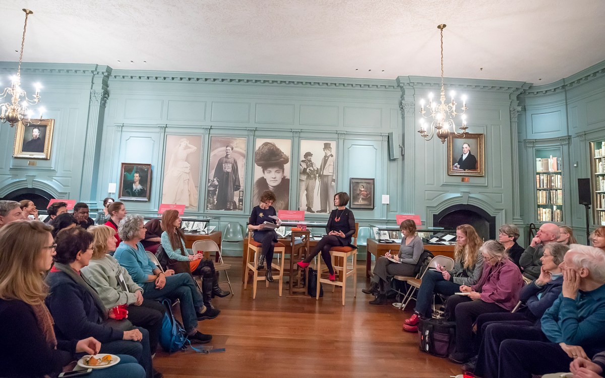 Speakers Anne Pender and Geraldine Brooks are sit flanked by audience at Houghton Library.