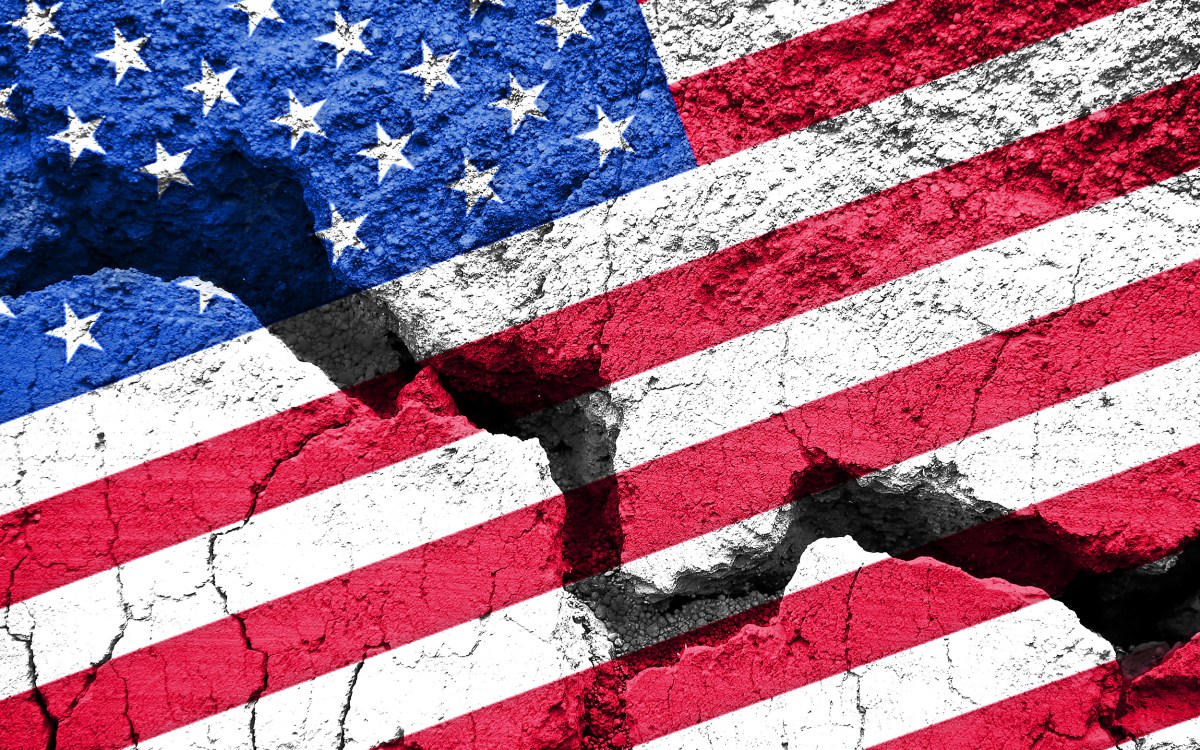 U.S. flag on cracked background.