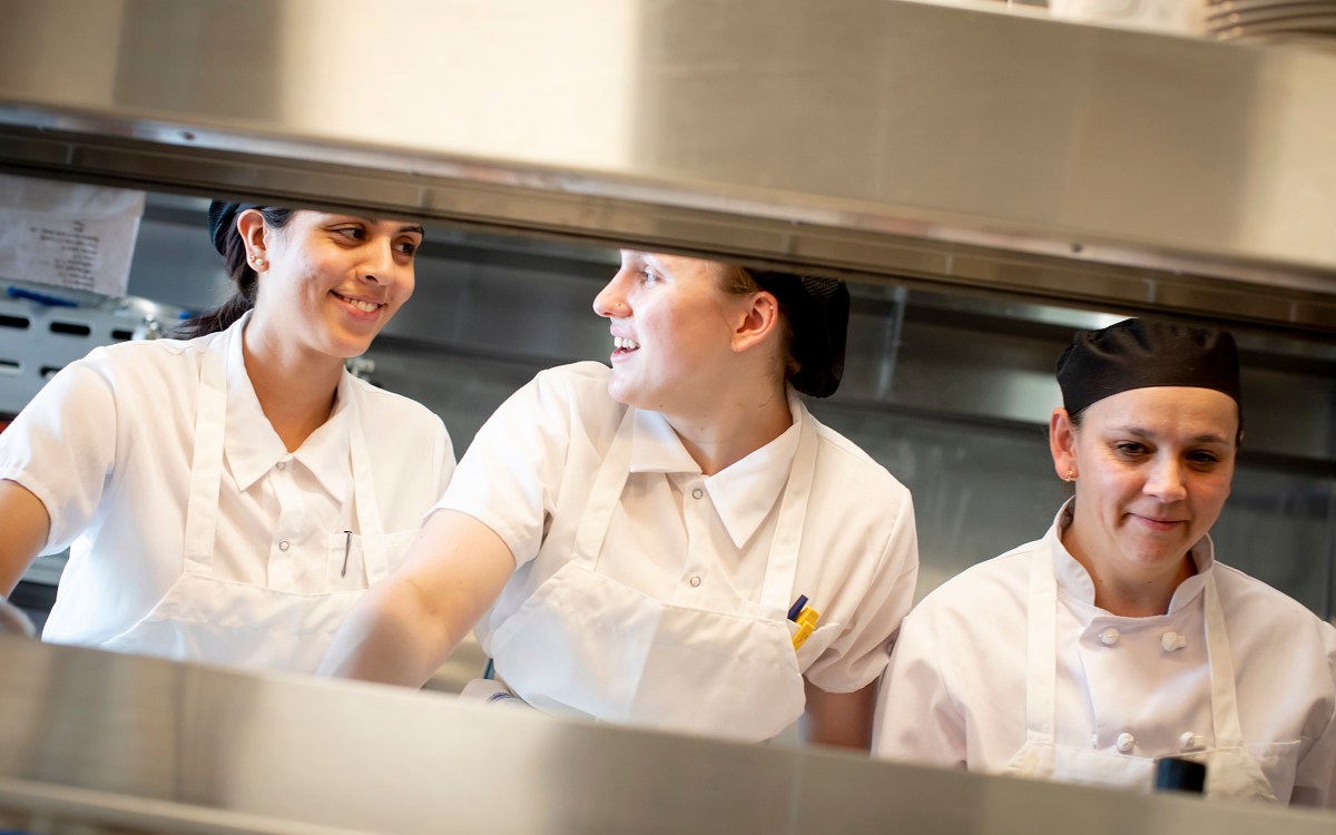 Chefs, Vanessa Portiza Acosta, from left, Corrine Gaucherin and Luz Restrepo Rincon work on the line in the kitchen at The Heights