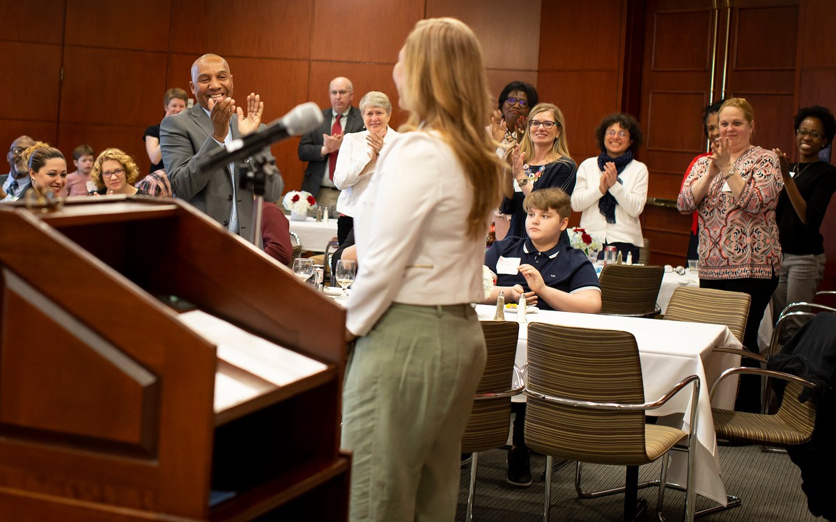 Luz Orozco receives a standing ovation after speaking at the Bridge Program annual dinner.