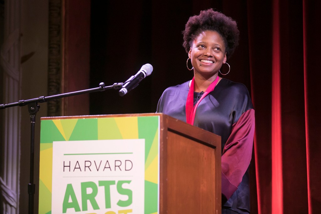 Tracy K. Smith smiles at the podium