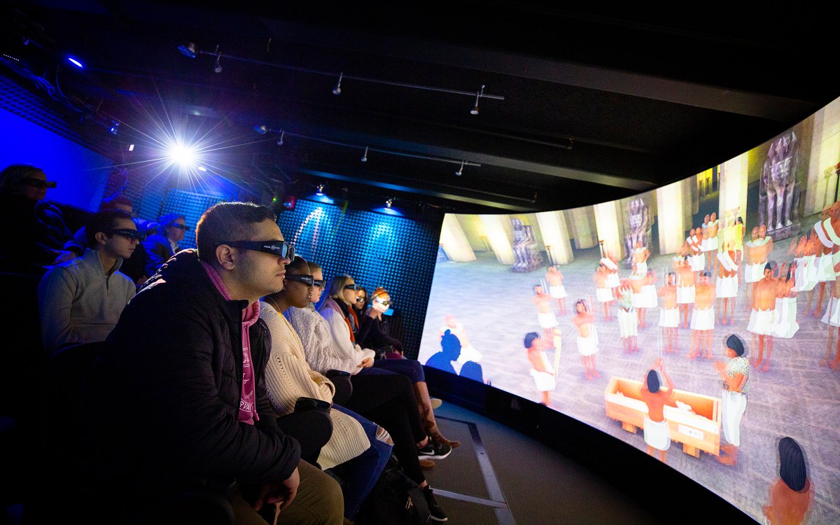 Students wearing 3D glasses view a visualization of an Egyptian tomb.