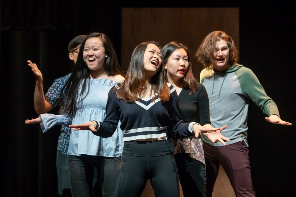 Performers dancing and singing