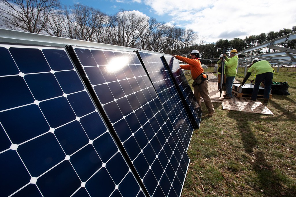 Installing solar panels at the Arnold Arboretum's Weld Hill property