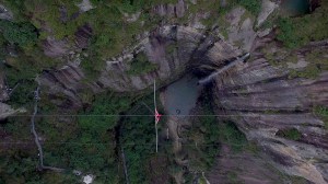 Tightrope walker over a canyon
