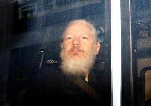 Julian Assange in a police van.