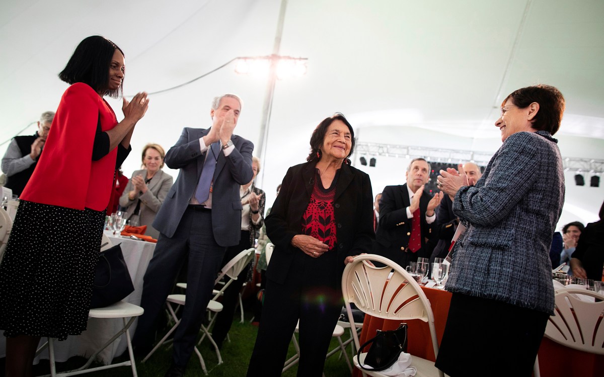 Dolores Huerta (center) is given a standing ovation from the audience.