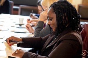 Woman writing thank-you note.