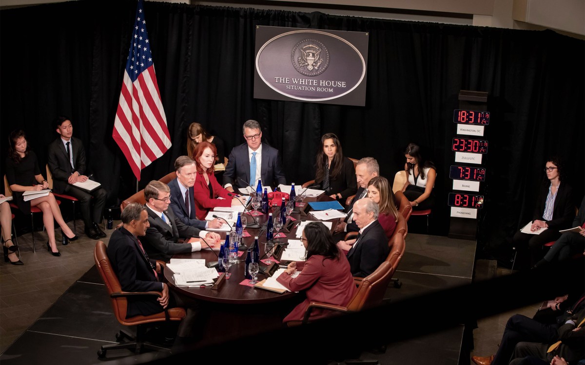 People sitting around a conference table.