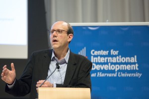 Michael Kremer speaking at a podium