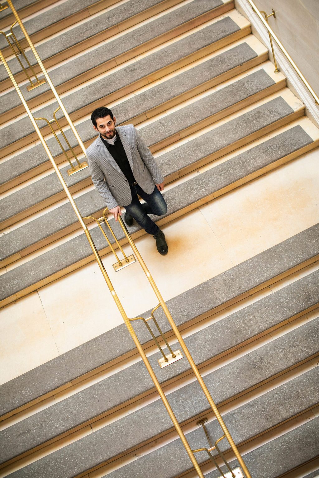 Mosab Abu Toha walking down the stairs.