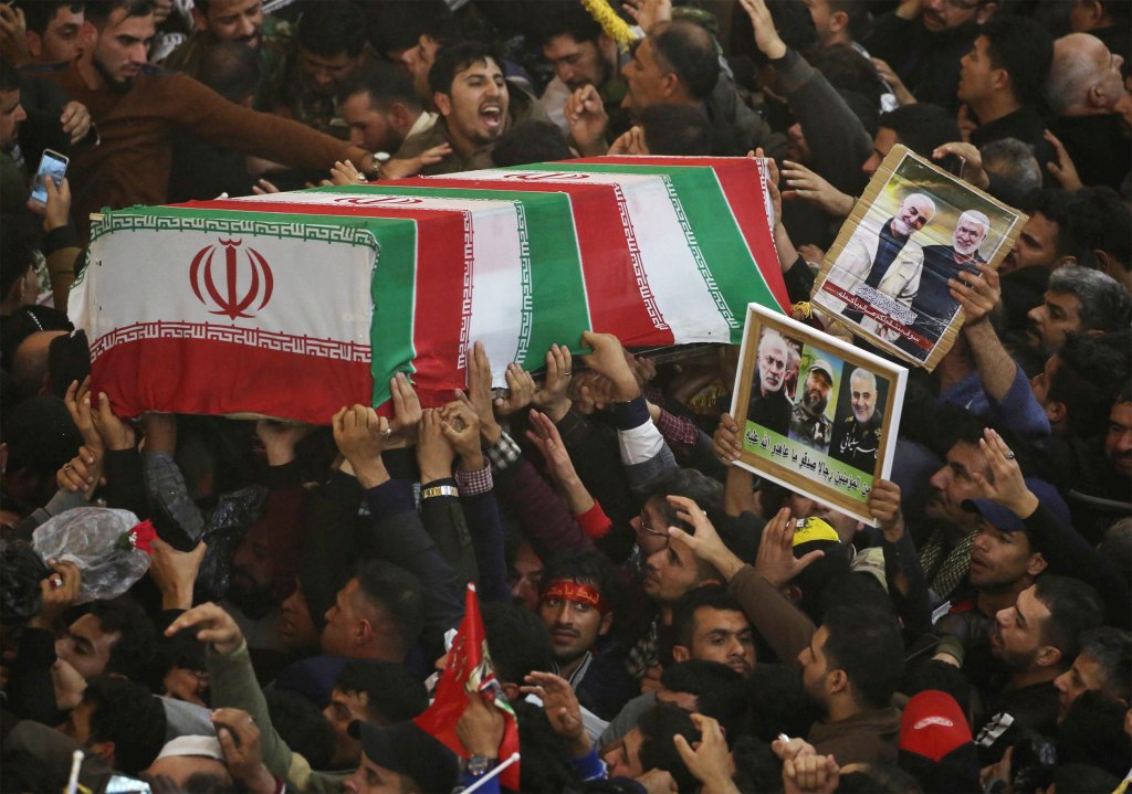 Mourners attend the funeral procession.