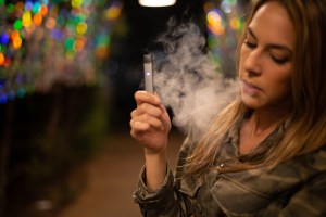 Woman using Juul.