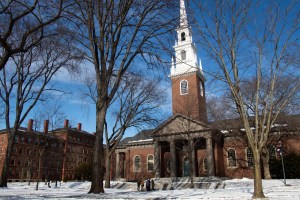 Visitors walk through Harvard Yard.