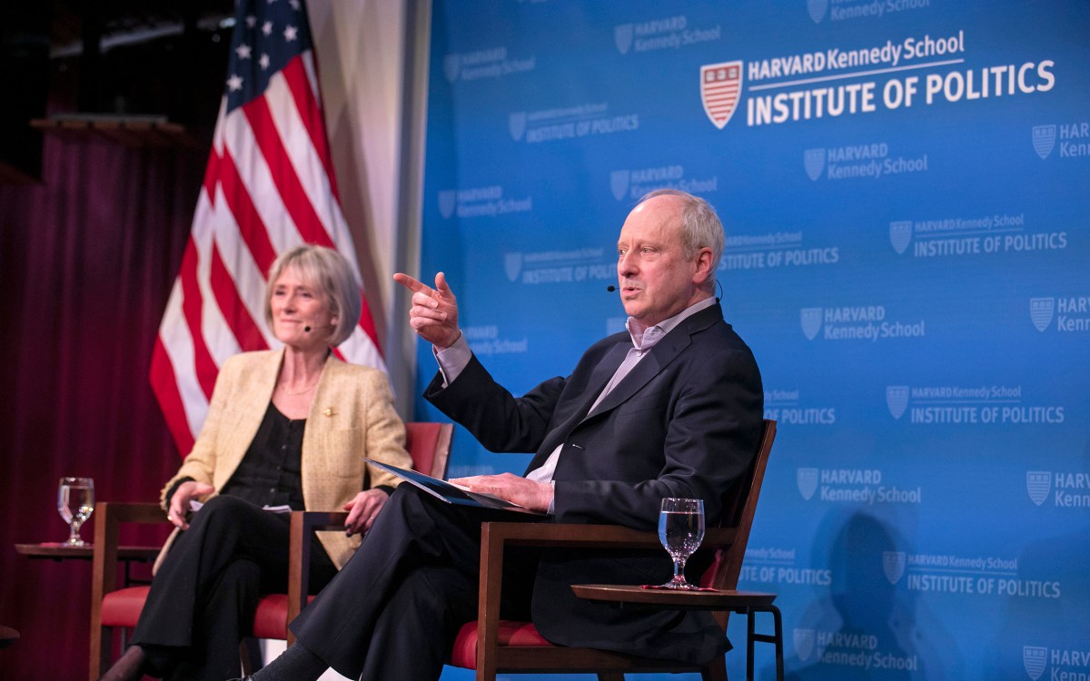 Gwyneth Williams and Michael Sandel onstage at HKS.