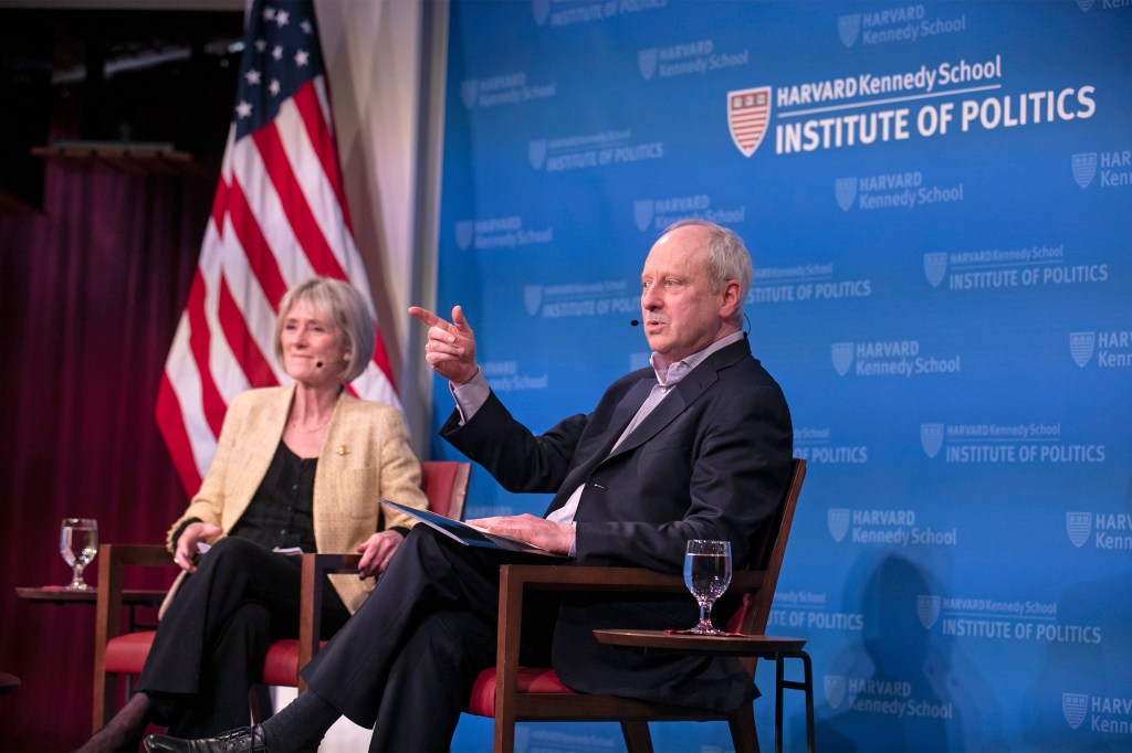 Gwyneth Williams and Michael Sandel onstage at HKS.