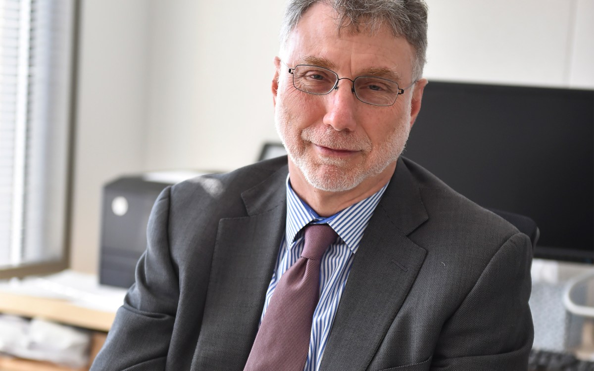 Photo of Marty Baron at his desk.