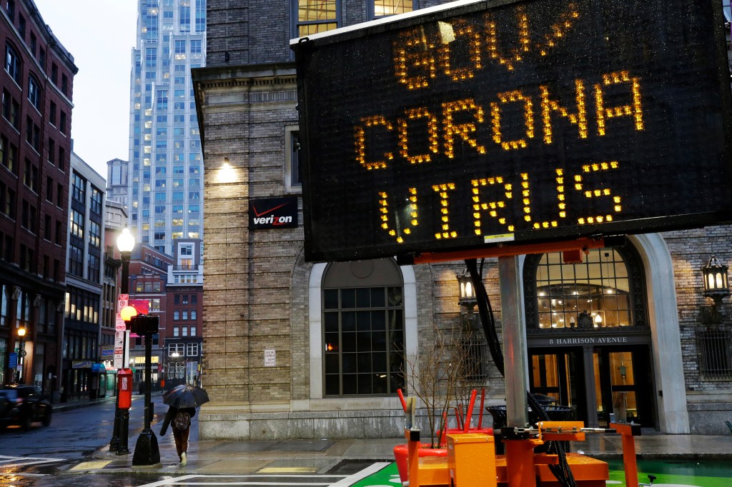 Mobile road sign in Boston directs people to government coronavirus website.