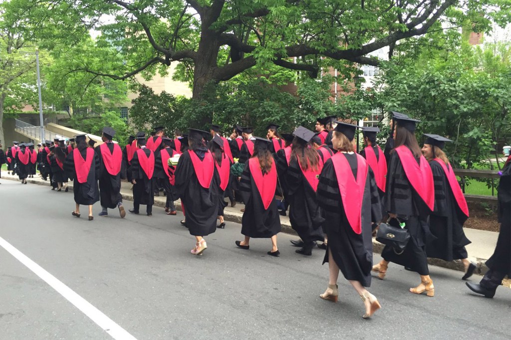 Harvard Medical School graduates walking,