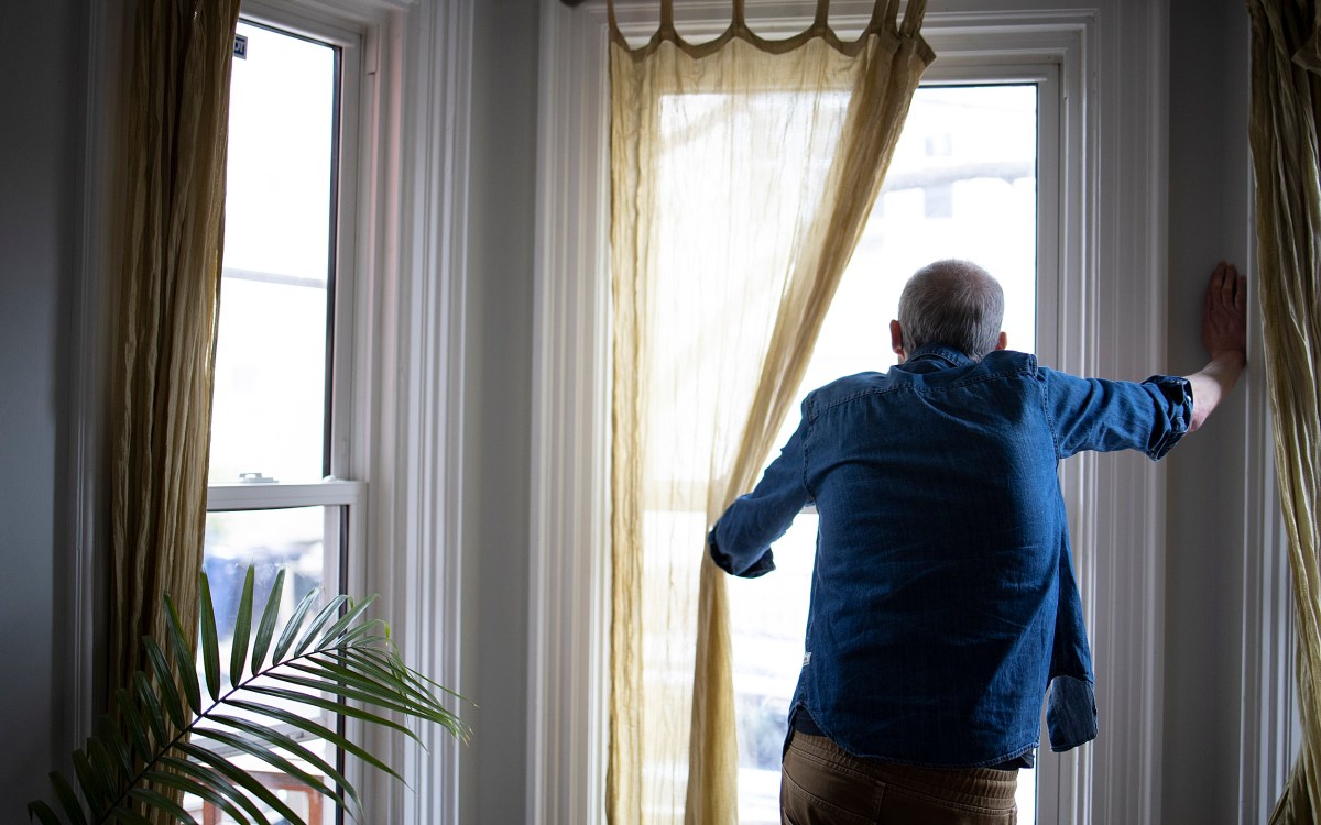 Man looking out the window.