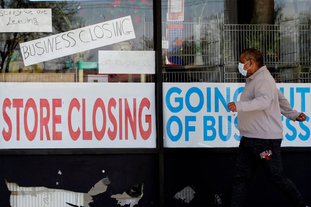 Store closing signs in window.