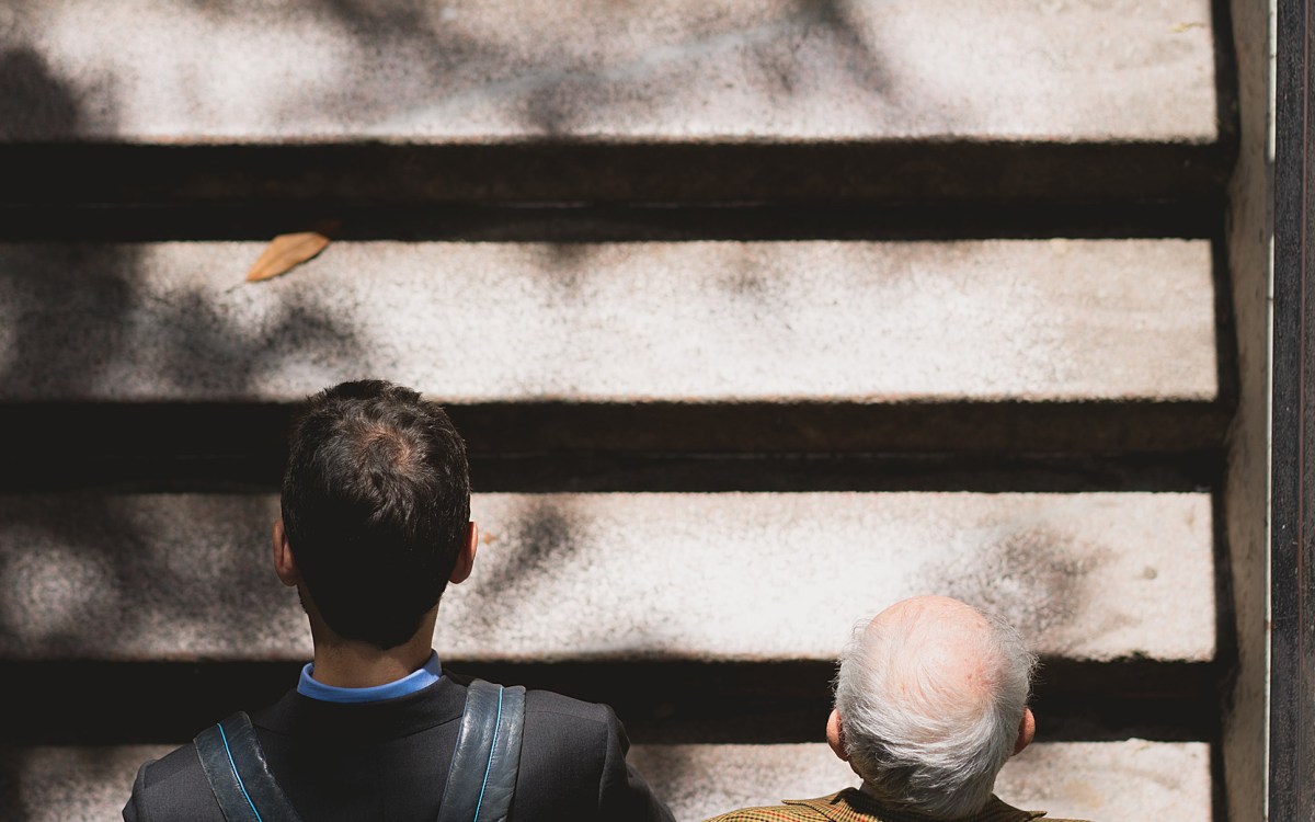 Two people going up stairs.