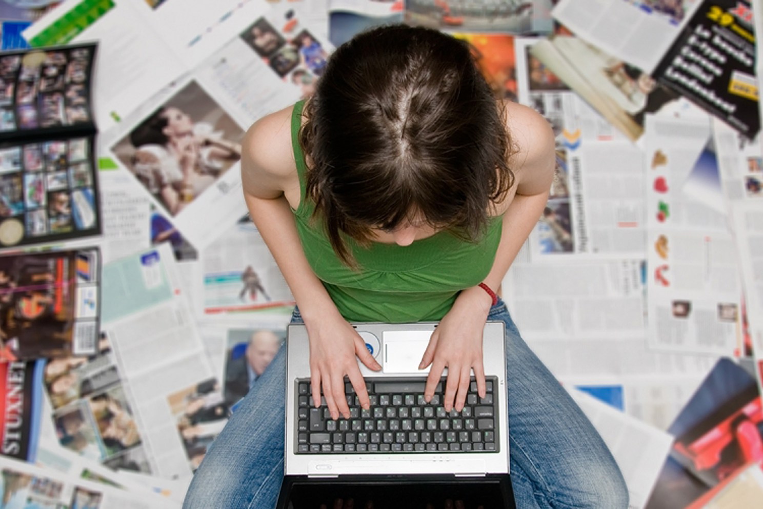 Teenager using a laptop.